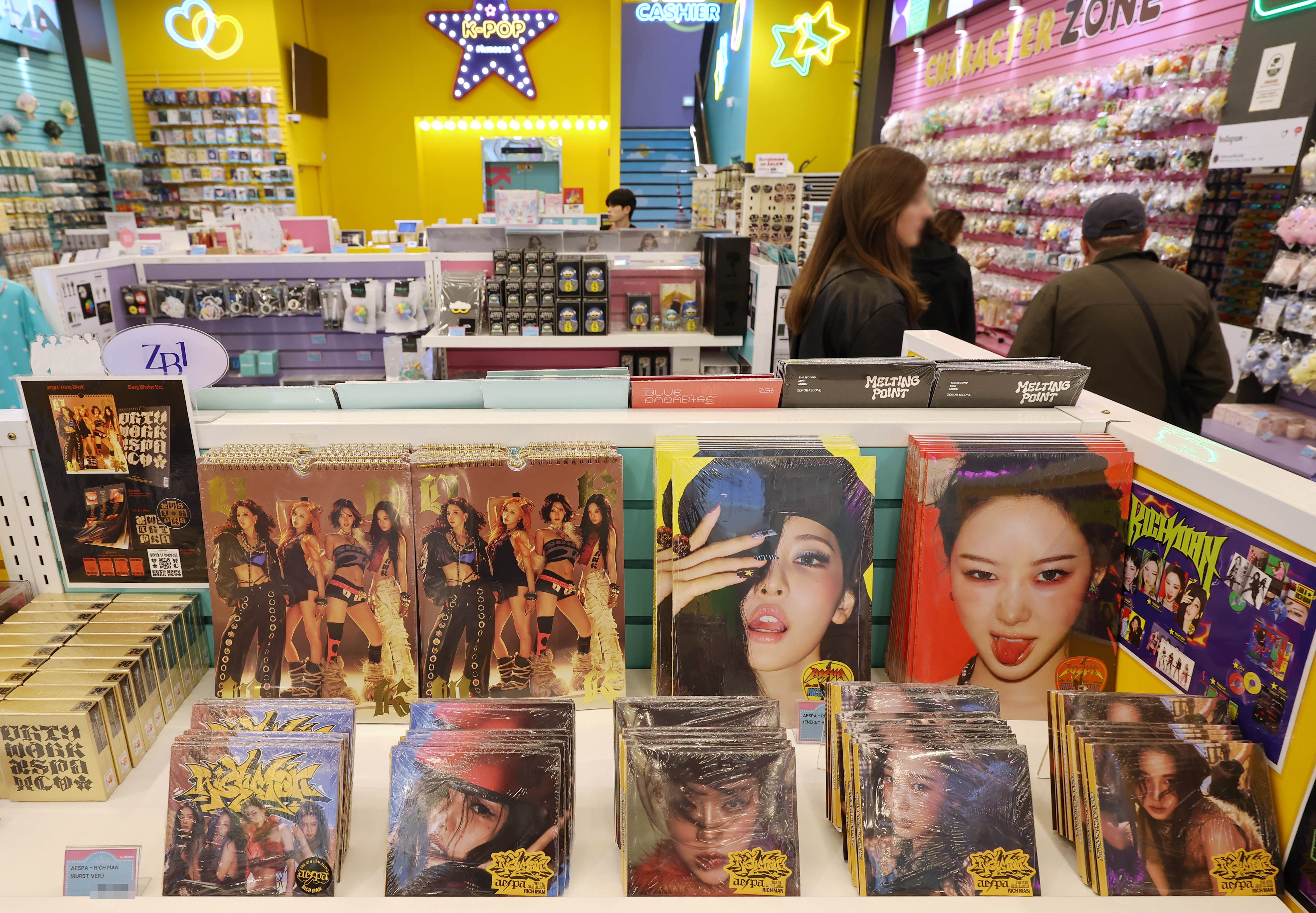 Customers on April 28 look at albums on display at a K-pop merchandise store in the Myeong-dong neighborhood of Seoul's Jung-gu District. (Yonhap News)