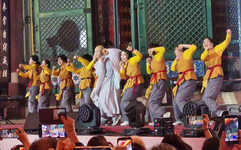 Monks and performers present an energetic dance performance at Jogyesa Temple in Seoul on May 16