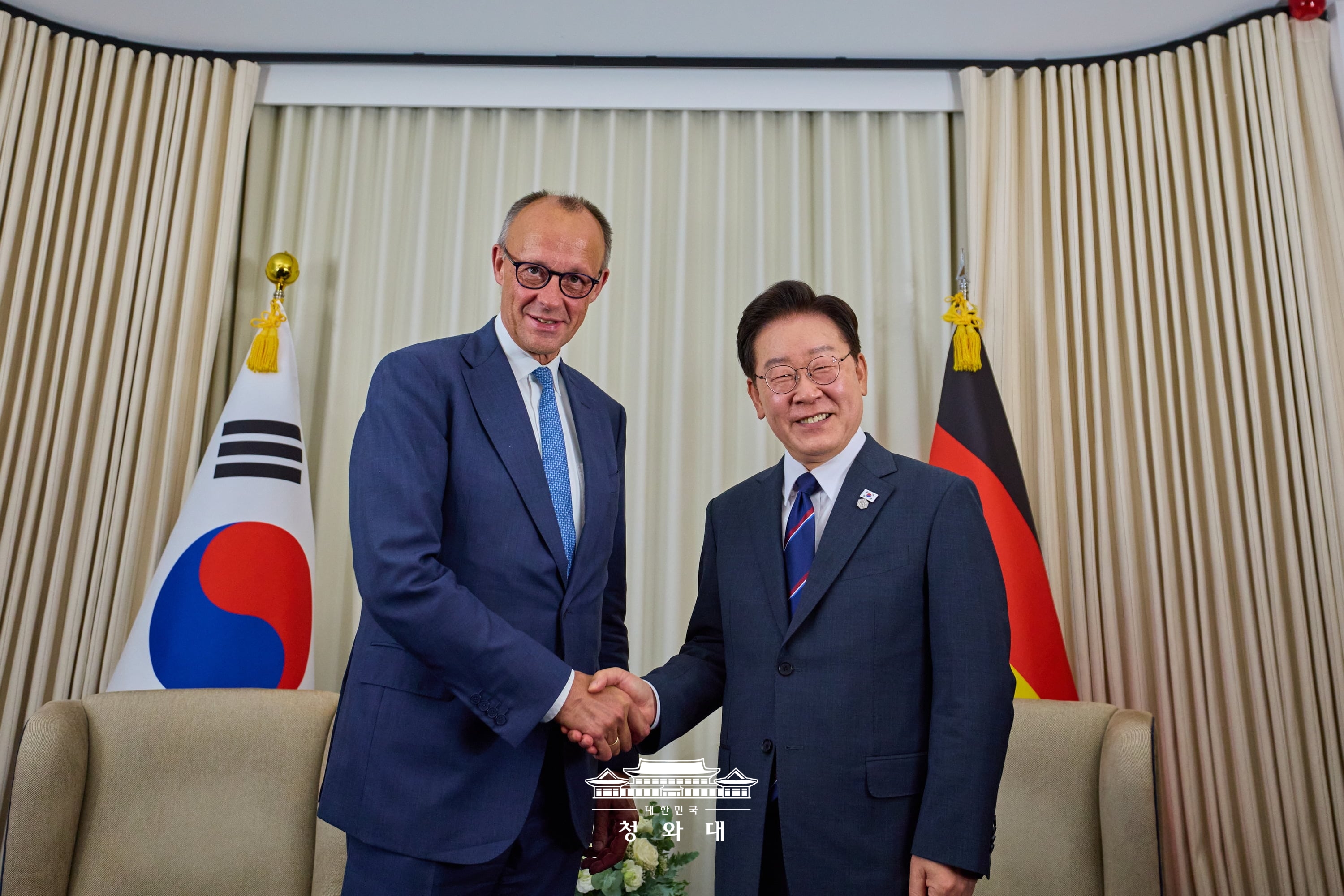 President Lee Jae Myung (right) and German Chancellor Friedrich Merz on June 16 shake hands after their bilateral summit at the G7 summit in the French resort town of Evian-les-Bains.