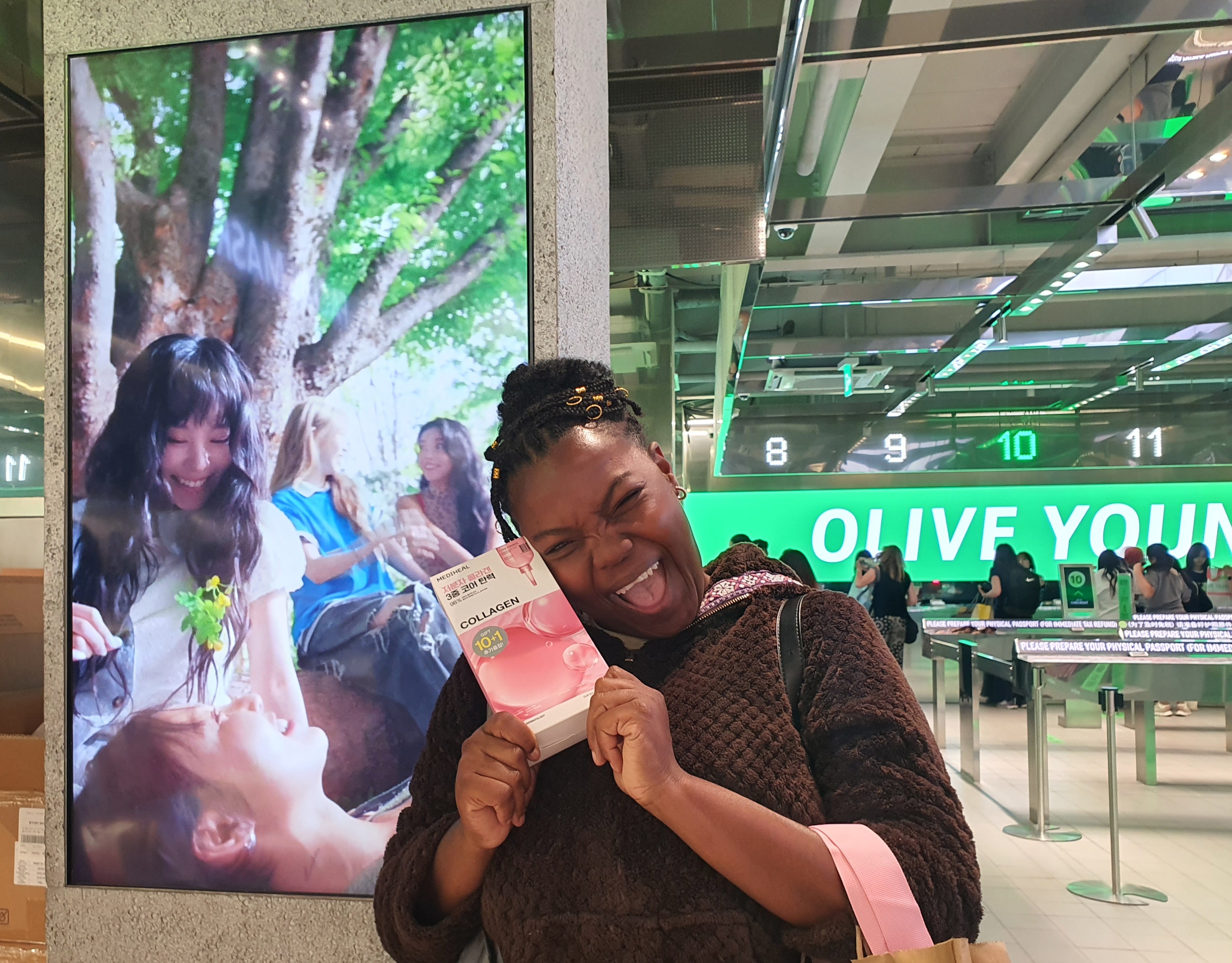 Roxanne of Jamaica on June 24 smiles after finding the product she was looking for at a beauty store in the Myeong-dong neighborhood of Seoul's Jung-gu District. (Uyen Nguyen)