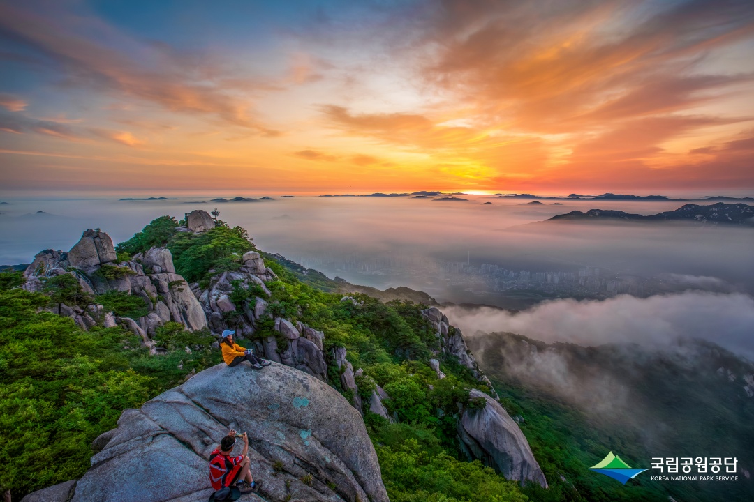 This gorgeous view from the summit of Bukhansan Mountain shows why mountain hiking is growingly popular among foreign tourists in Seoul. (Korea National Park Service)  