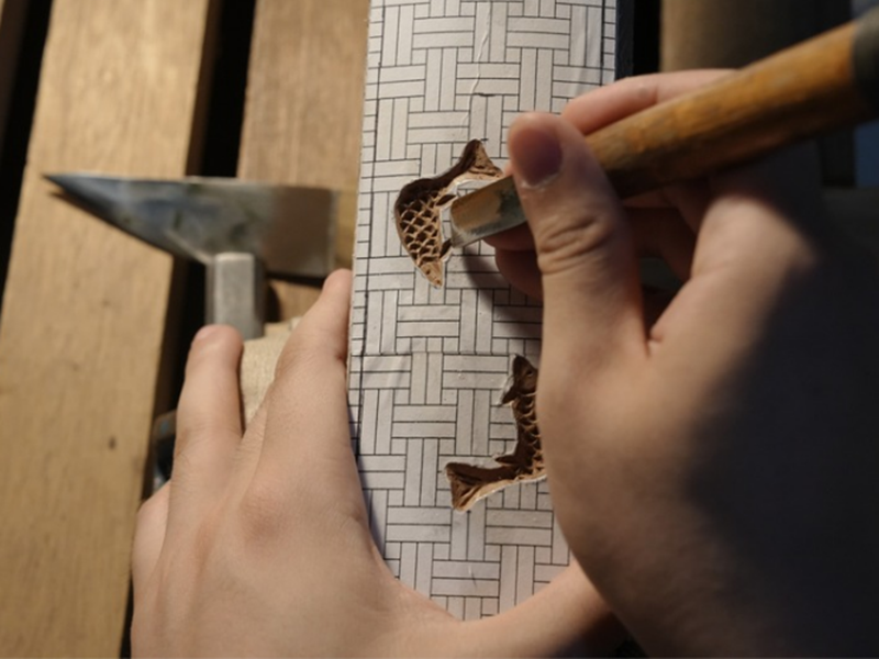Kim Do-hyeong in May carves intricate patterns onto a woodblock with traditional tools. (Courtesy of Kim Do-hyeong)