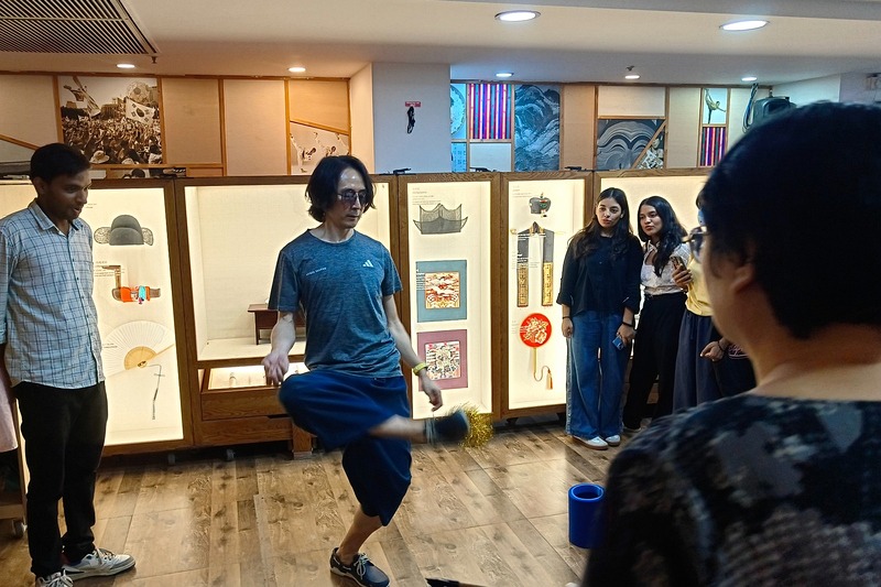 A Korean Cultural Centre India (KCCI) instructor on Sept. 24 demonstrates jegichagi(shuttlecock kicking) during the 