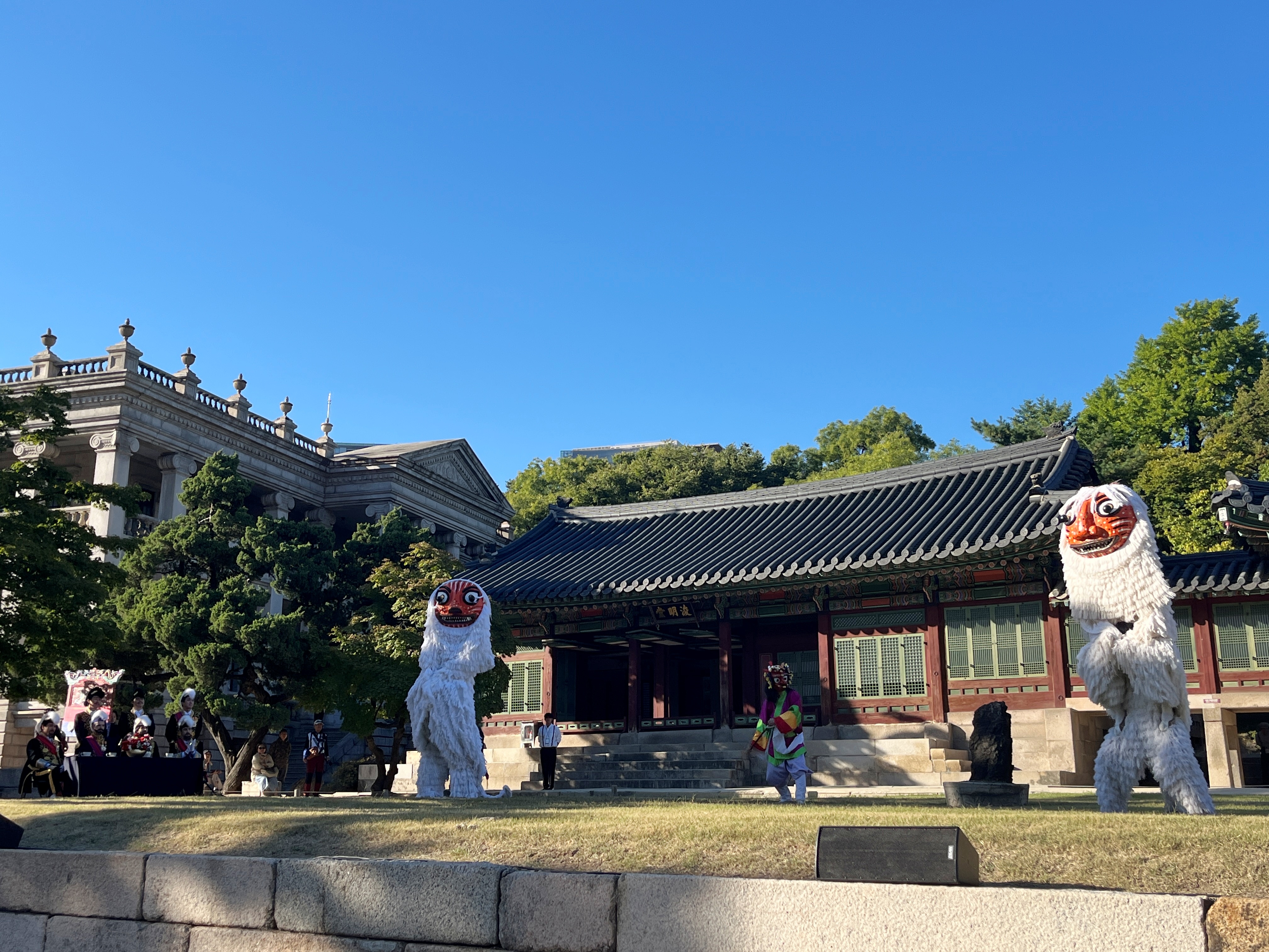 Reenactment of lion dance at courtyard in front of Jikjodang and Junmyeongdang halls at Deoksugung Palace