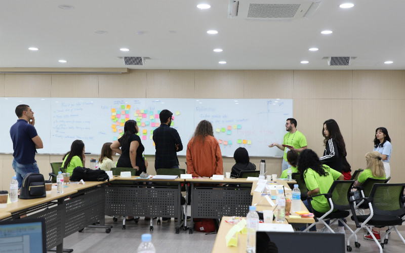 Each of the nine discussion groups brainstormed on issues and their solutions.