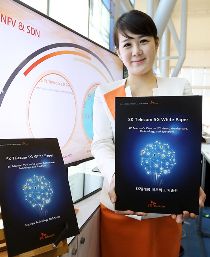 SK Telecom shows off its 5G White Paper during the 5G Global Summit on October 20. (photo courtesy of SK Telecom)