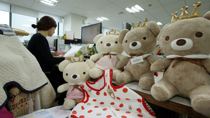 Agabang’s family of teddy bears waits patiently in the offices of the firm's fashion design department. Their names are Ailee, Aiden, and Aibee.