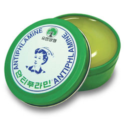 The old packaging for Antiphlamine ointment is in a green tin with a picture of a nurse. This product has been discontinued.