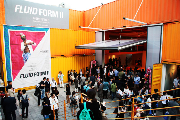 People visit the Arabic modern art exhibition, one of the sideline events of the Arab Cultural Festival.