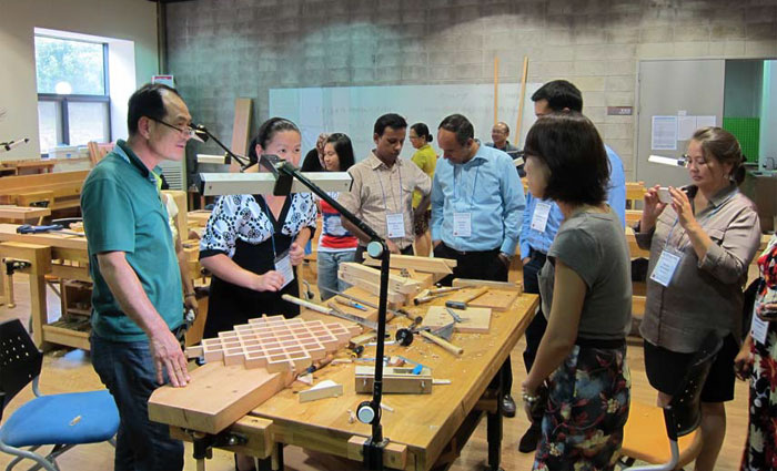 Participants of the International Course for Cultural Heritage Management visit an education center that teaches traditional wooden craft skills. (photo courtesy of the Training Center for Traditional Culture)