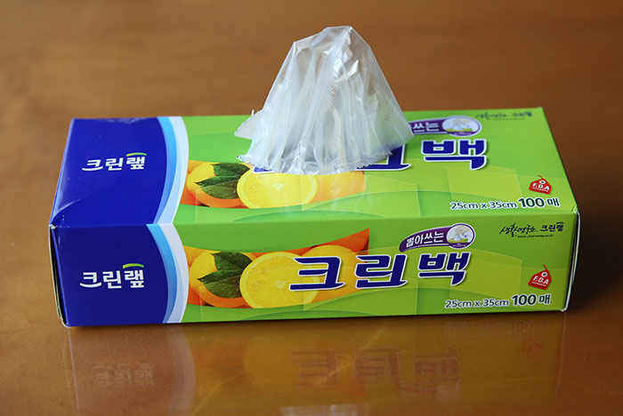 Clean Bags are thick, strong vinyl bags. Each individual bag is dispensed from the box like a box of tissues.