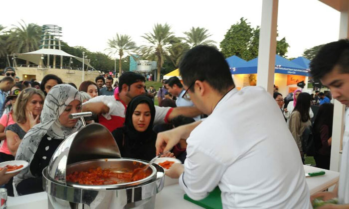 People queue up to sample some Korean food at the K-Food Fair in Dubai on Nov. 27.
