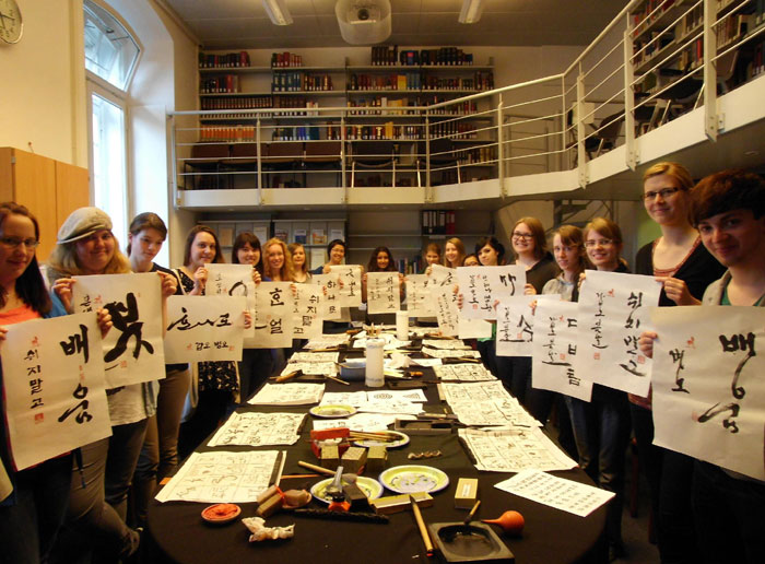 Students at the King Sejong Institute in Bonn, Germany, show off their Korean calligraphy.