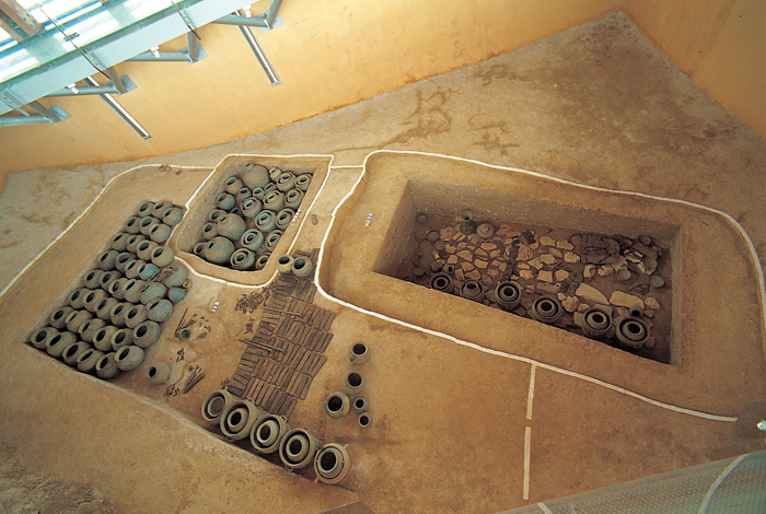 Two wooden coffins have been reproduced on a hill near the Daeseong-dong Tombs Museum.