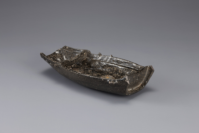 Bird-shaped pottery items (top) and ship-shaped pottery items are major artifacts on display at the Gimhae National Museum.