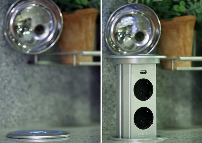 An electrical outlet pops up from the surface of a Hanssem kitchen counter. This reflects life style changes in the modern family, which does many things in the kitchen.