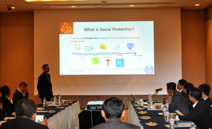 Participants in the ASEAN-ILO-Korea Training Workshop on Employment Injury Insurance for Cambodia and Myanmar listen to a lecture from an ILO staff member.