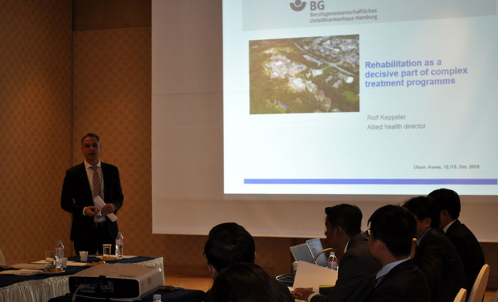 Participants listen to a lecture by a rehabilitation specialist from a hospital in Hamburg, Germany.