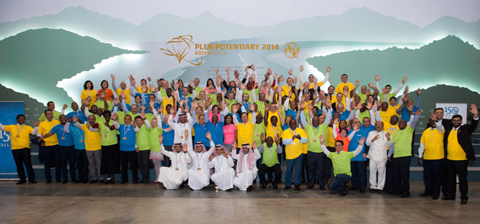 Participants in the ITU conference pose for a photograph before the closing ceremony. 