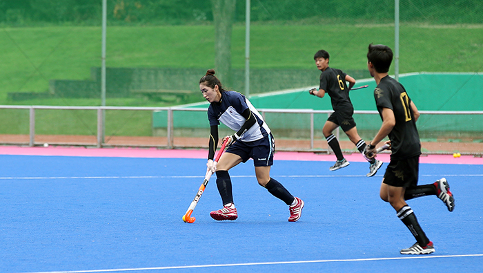 Female hockey players do their daily training with male hockey players on August 20.