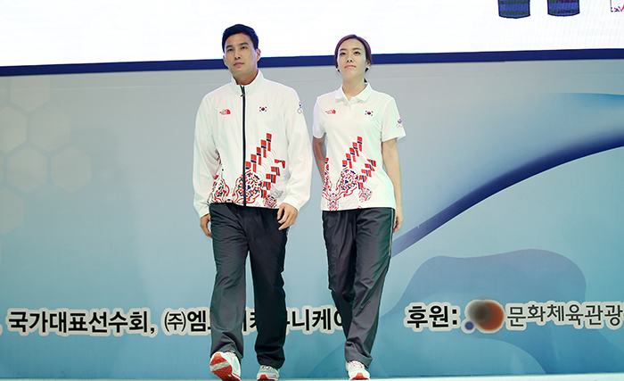 Models wear the official Incheon Asian Games 2014 clothing. Athletes will wear the outfit when they attend a medal award ceremony.