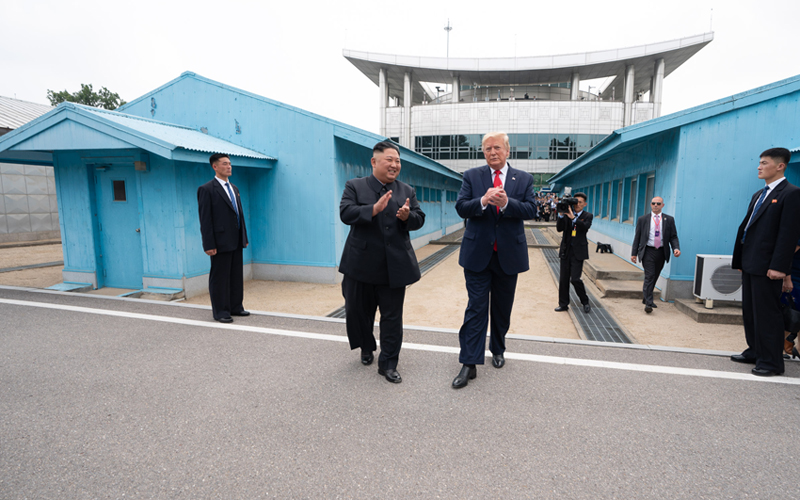 U.S. President Donald Trump and North Korean leader Kim Jong Un on June 30 walk toward North Korean territory after greeting each other in Panmunjeom. As the first incumbent American president to enter the North, Trump took 20 steps into the country and posed for photographs taken by hordes of reporters in the southern part of Panmunjeom. (White House)