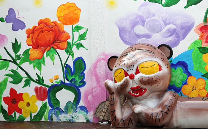 At Gyodong Minhwa Village, 80 <i>minhwa</i> folk paintings (민화) grouped into seven themes decorate the town. The tiger in the photo above is one of the symbols of the village.