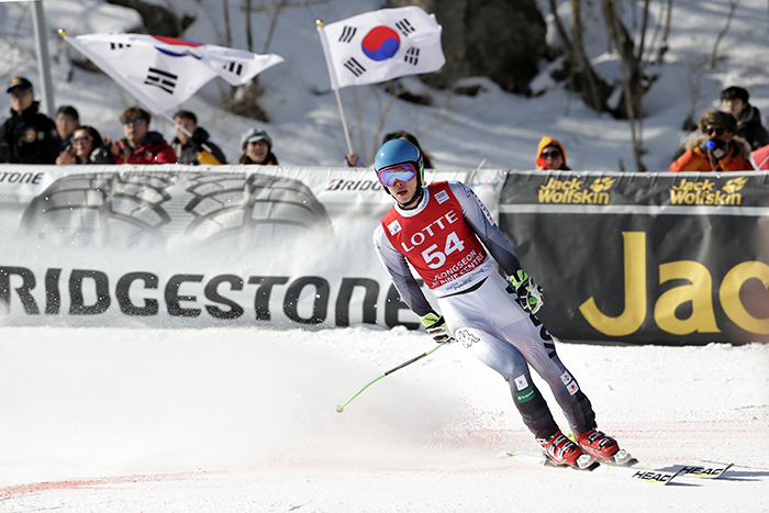 Kim Hyeon-tae crosses the finish line during a men's World Cup super-G race, a test event for the PyeongChang 2018 Winter Olympics, at the Jeongseon Alpine Center in Jeongseon in February 2016. The Jeongseon Alpine Center designed its courses so as to minimize damage to nearby forests and to minimize any effects on the environment.