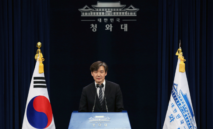 The newly appointed senior presidential secretary for civil affairs, Cho Kuk, delivers an announcement at the Chunchugwan press center at Cheong Wa Dae on May 11.