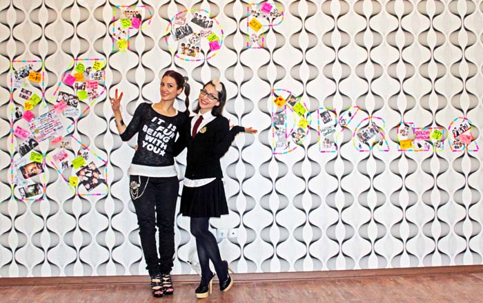 One of Roshana Moslemzadeh’s photos features the photographer herself posing against a wall with photos of Korean pop singers. 