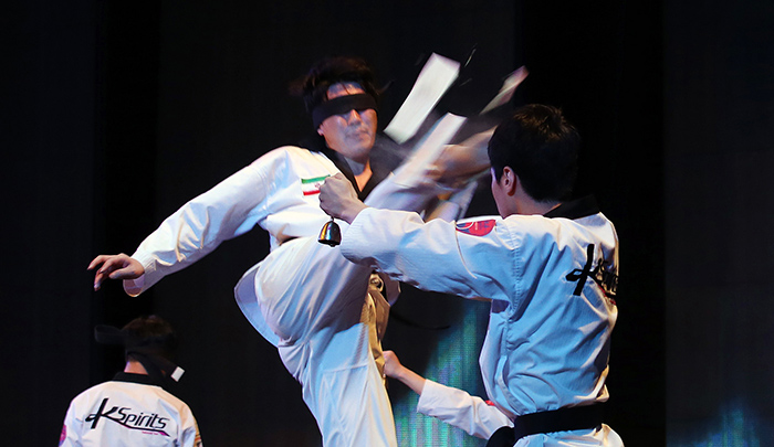 Korean and Iranian athletes demonstrate their taekwondo moves in the Korea-Iran One Heart Festival at the Milad Tower in Tehran on May 2. Taekwondo is so popular in Iran that more than 2 million people train in the martial art.