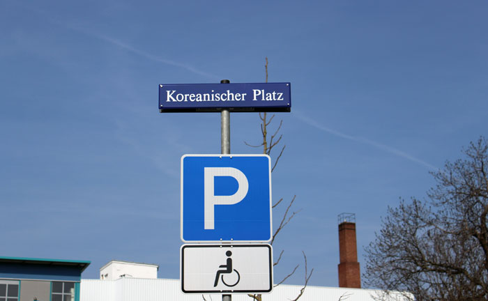 The sign indicates the Korean Plaza in Dresden, Germany.