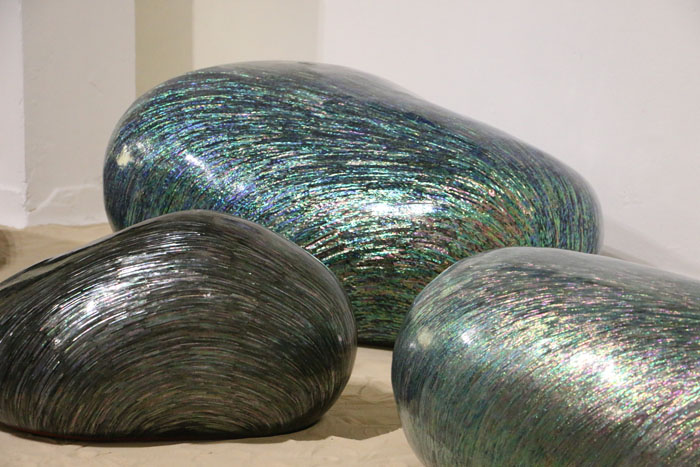 'Pebbles,' a collection of stone-shaped sculptures, is inlaid with mother-of-pearl by Hwang Sam-yong.