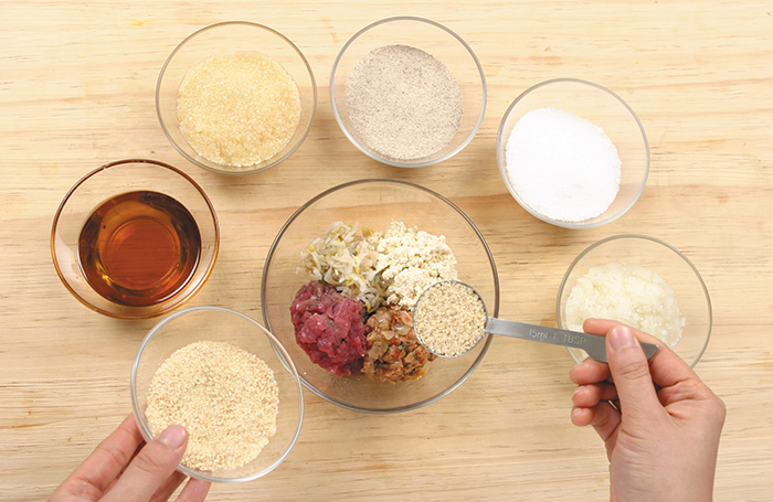 Make the filling by mixing all the chopped ingredients together in one bowl. You can add potato starch noodles or other ingredients, too, depending on individual taste.