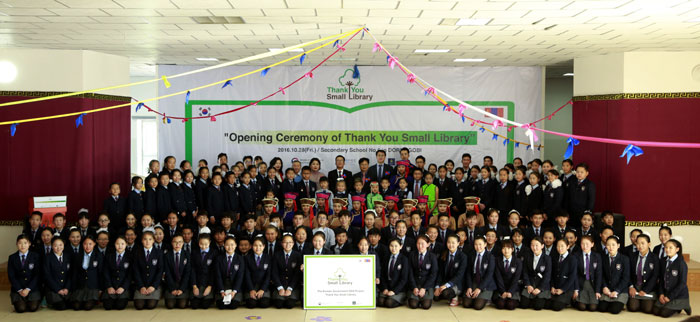 Students, teachers and representatives from Mongolian educational authorities pose for a photo during the opening ceremony of the Thank You Small Libraries book center at Secondary School No.5 in Sainshand, Dornogobi Province, on Oct. 28.