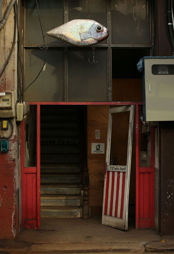 A sculpture of an elephant, a porcelain vase and a fish-shaped decoration catch the eyes of visitors to the street of metalsmiths in Mullae-dong.