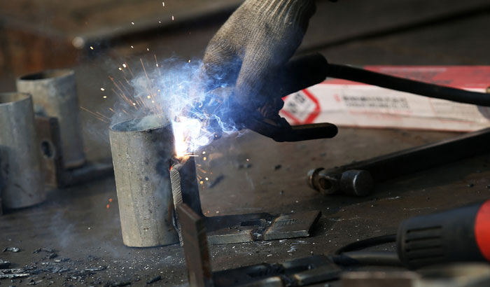 It is easy to spot workers welding and cutting iron and other metals in Mullae-dong.