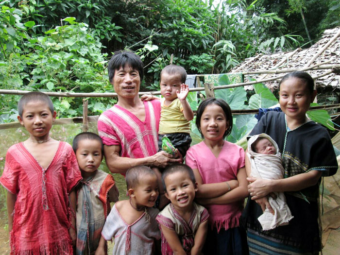 Family members of Maung Tai Aung (third from left, back row) have lived in refugee camps in Myanmar. He had been working as a farmer and his children had been unable to receive a public education.