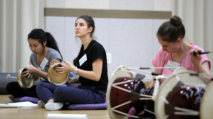 Performers from the Haedong art troupe play traditional musical instruments at the Jindo National Gugak Center. There is the drum-like <i>janggu</i>, the piercingly-loud small, flat gong <i>kkwaenggwari</i> and the gong-like <i>jing</i>. 