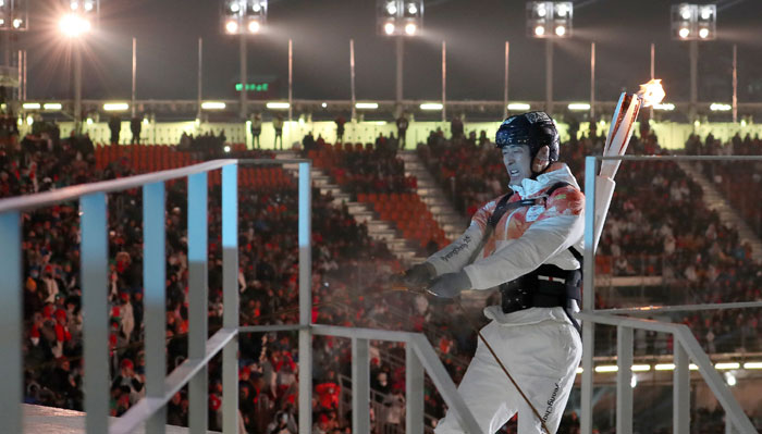 Han Minsu, the leader of the Korean para ice hockey team, climbs to the torch platform during the Opening Ceremony of PyeongChang 2018 Paralympic Winter Games, at the PyeongChang Olympic Stadium on March 9. (Heo Man-jin, Ministry of Culture, Sports and Tourism)