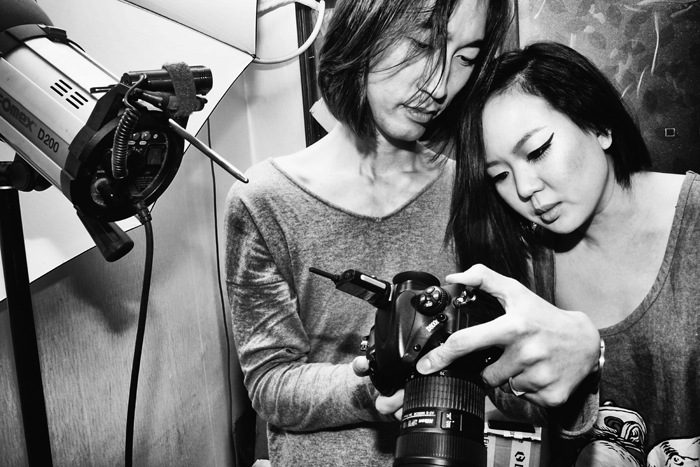 Checking out the back of his camera, House and Rydia look over the preliminary studio shots before they go into post.