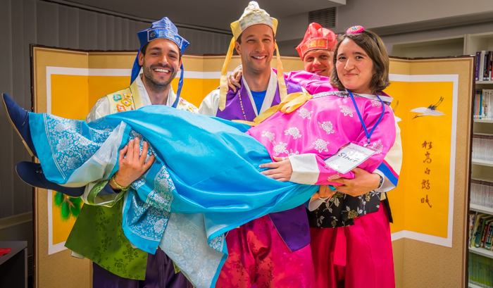 Visitors to Korean Cultural Night have fun wearing Hanbok.