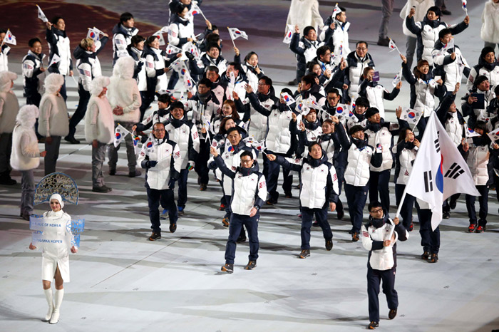 Team Korea, with flag-bearer Lee Kyou-hyuk, enter the stadium during the opening ceremony in the Fisht Olympic Stadium at the Sochi 2014 Olympic Games in Sochi, Russia, on February 7. (Photo courtesy of the Korean Olympic Committee)