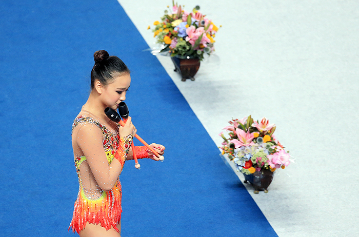 Son Yeon-jae kisses her clubs after finishing her clubs routine in the individual all-around finals at the 2015 Gwangju Summer Universiade on July 12.