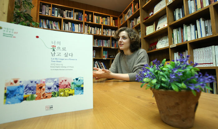 Bowman said learning and translating Korean literature is not easy, but that she enjoys it. The book on the left is, “Let Me Linger as a Flower in Your Heart,” which she translated into English.