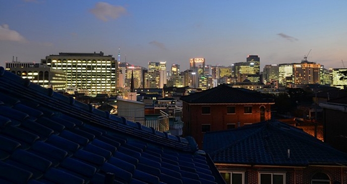 Downtown Seoul glows in the distance. 