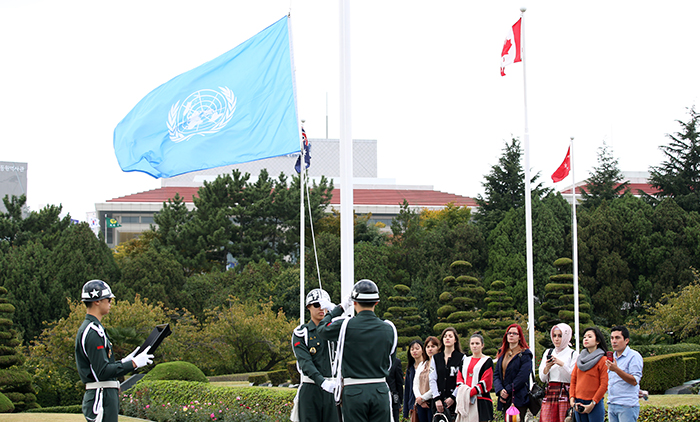 Soldiers from the army's 53rd Division hoist the United Nations flag. The flag is hoisted every morning at 10 a.m., except for Mondays.