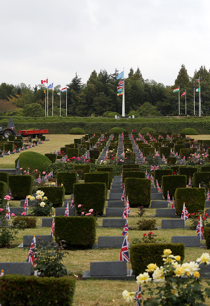  
Tomb stones and cenotaphs are set with the flags of individual countries.
