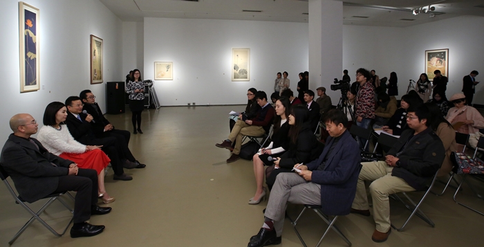 A press conference with organizers and media takes place ahead of the exhibit's opening ceremony.