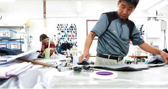 Employees of Eco Party Mearry, a design company specializing in upcycled products, are hard at work